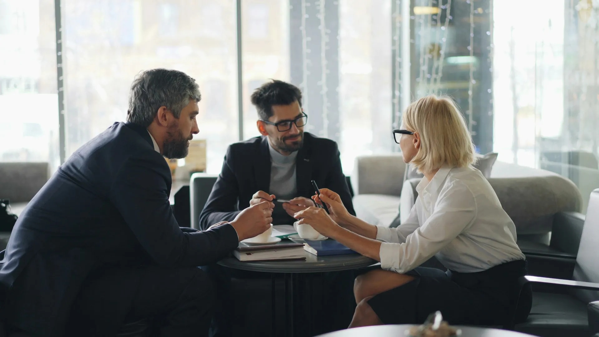 Business consultants meeting with a client in a modern office